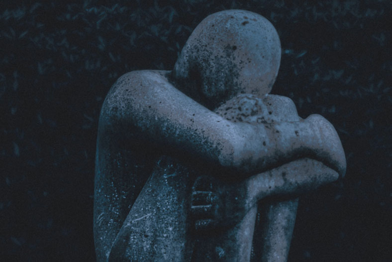 statue of a grieving person